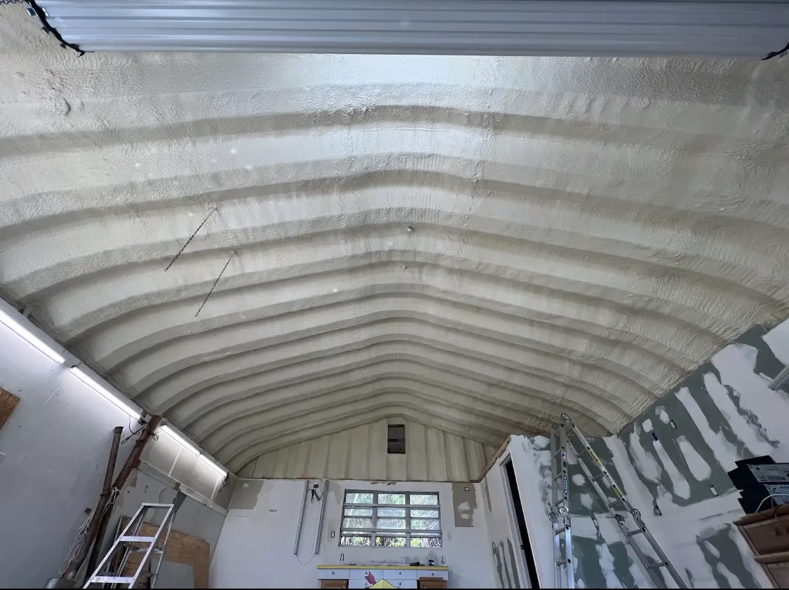 Spray polyurethane foam applied to the underside of a metal roof deck in South Weber